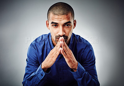 Buy stock photo Cropped shot of a young businessman posing against a grey background