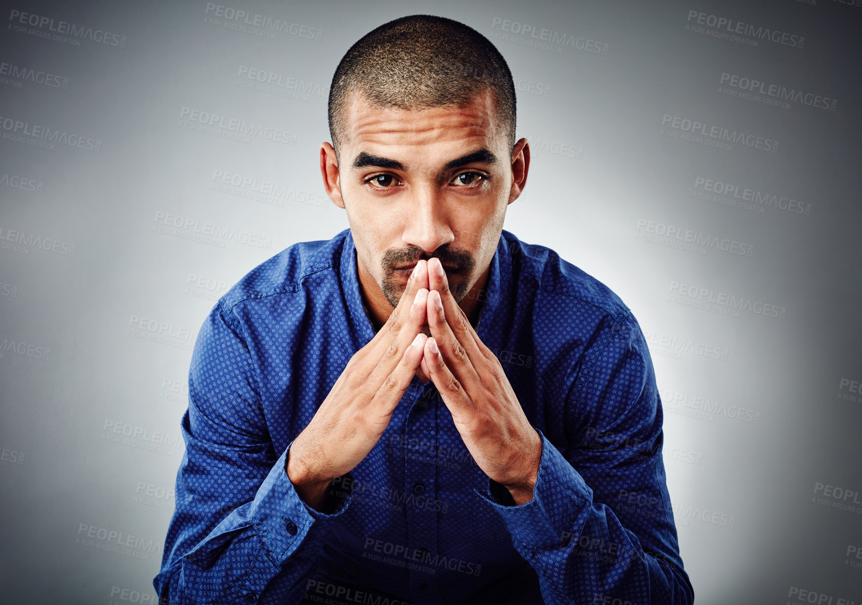 Buy stock photo Cropped shot of a young businessman posing against a grey background