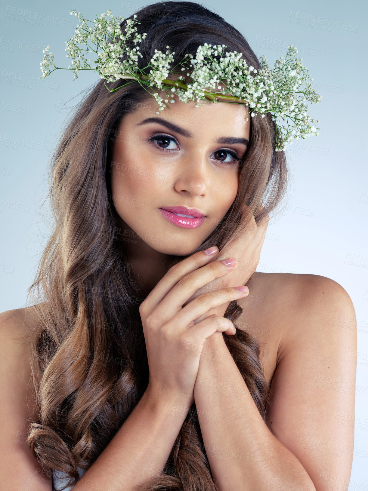 Buy stock photo Woman, hand and flower crown for beauty, skincare and organic for wellness on white background. Portrait, plant and natural cosmetics with makeup in studio, female model with grooming and glamour