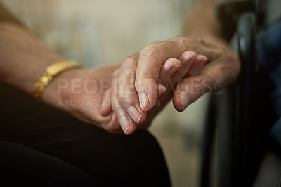 Buy stock photo Shot of an unidentifiable senior woman holding her husband's hand in an old age home