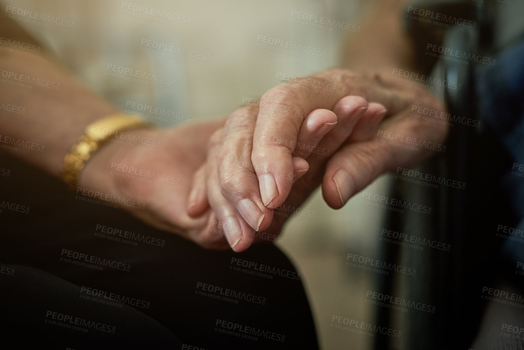 Buy stock photo Shot of an unidentifiable senior woman holding her husband's hand in an old age home