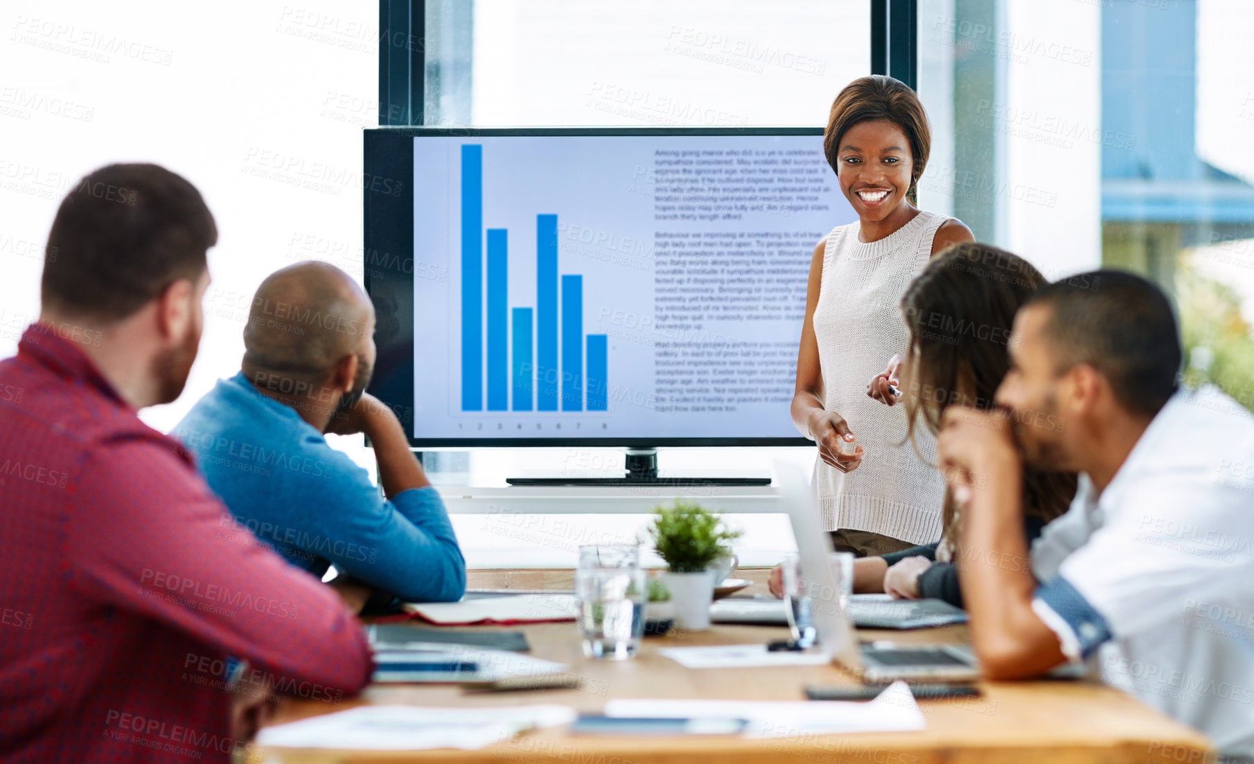 Buy stock photo Cropped shot of a young female designer giving a presentation in the boardroom