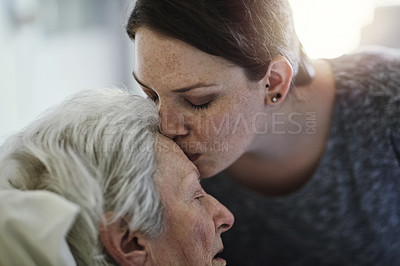 Buy stock photo Senior, daughter and kiss mother in hospital for healthcare, visiting sick patient and resting. Clinic, woman and kissing elderly mom on forehead with love, care and empathy, kindness and comforting.