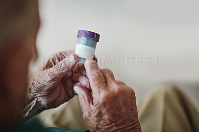 Buy stock photo Senior patient, hands and reading prescription with pills for illness, medication or sickness at old age home. Closeup of elderly or chronic person checking container for medical dose or side effects
