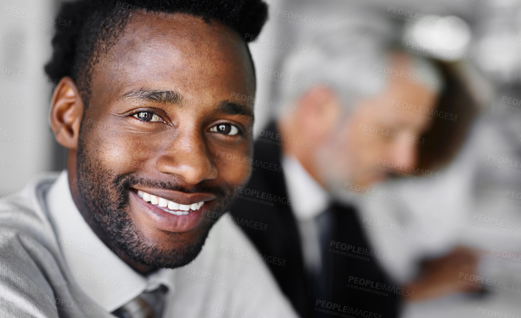 Buy stock photo Portrait of a businessman sitting in a boardroom meeting with colleagues blurred in the background