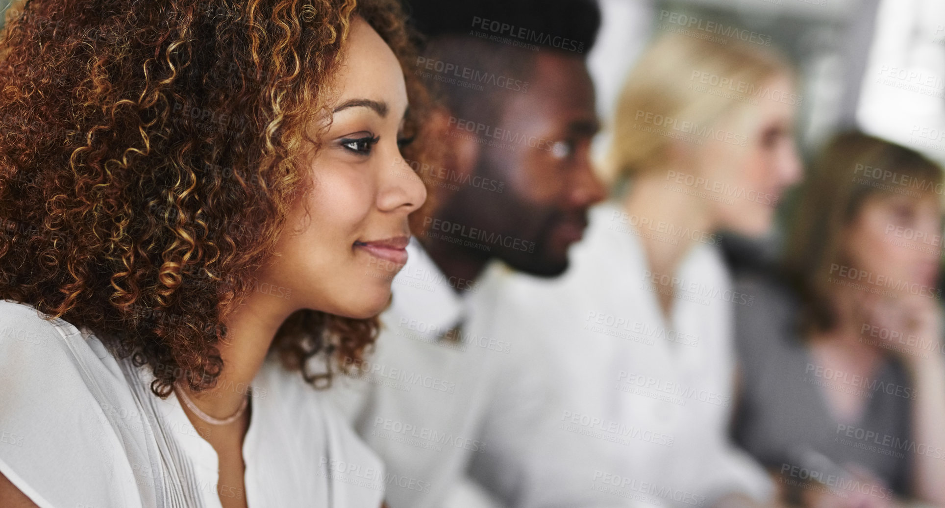 Buy stock photo Shot of a group of businesspeople sitting in a boardroom meeting