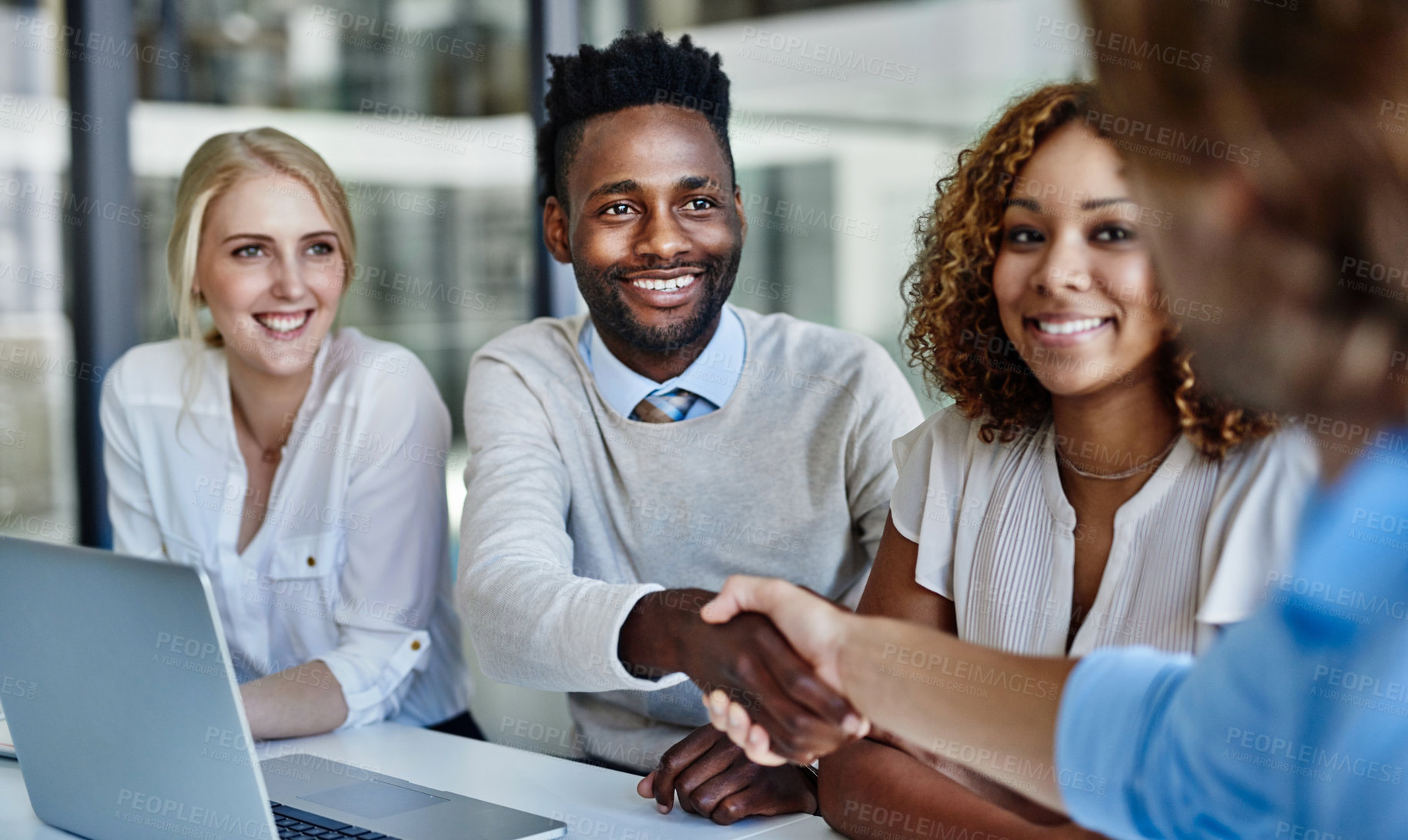 Buy stock photo Shot of businessmen shaking hands during a meeting at work