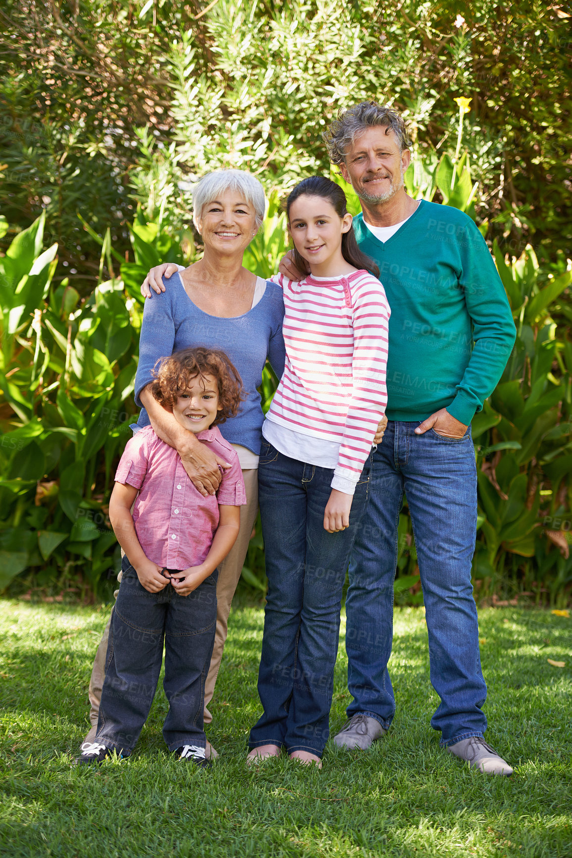 Buy stock photo Grandparents, portrait and hug in outdoors, children and bonding together or happy in backyard. Senior people, kids and peace or embrace for support in garden or park, vacation and holiday in France