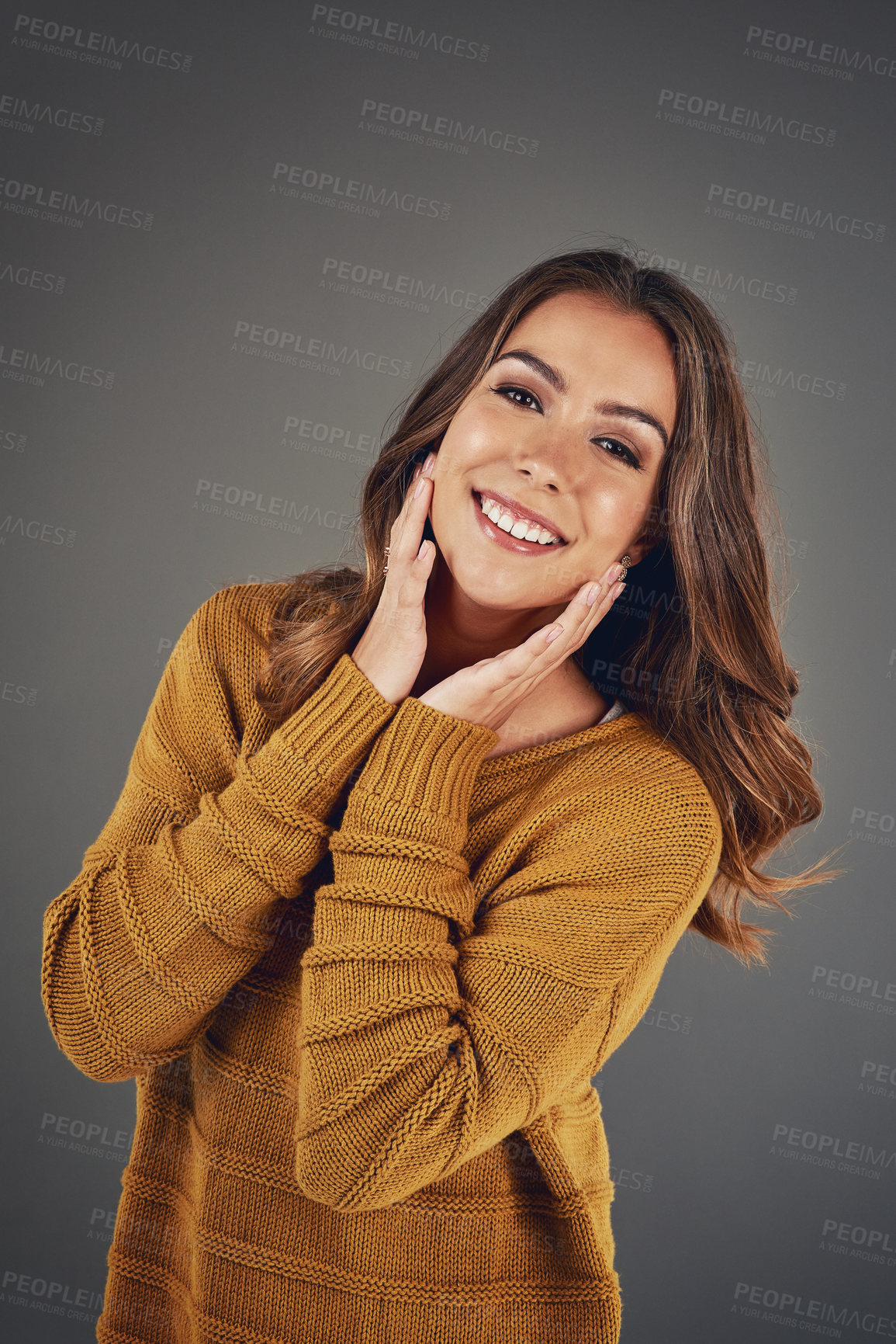 Buy stock photo Woman, portrait smile and winter fashion with organic fabric, style inspiration and beauty in studio. Model, happy and clothes for cold climate with designer brand, glow and jersey by gray background