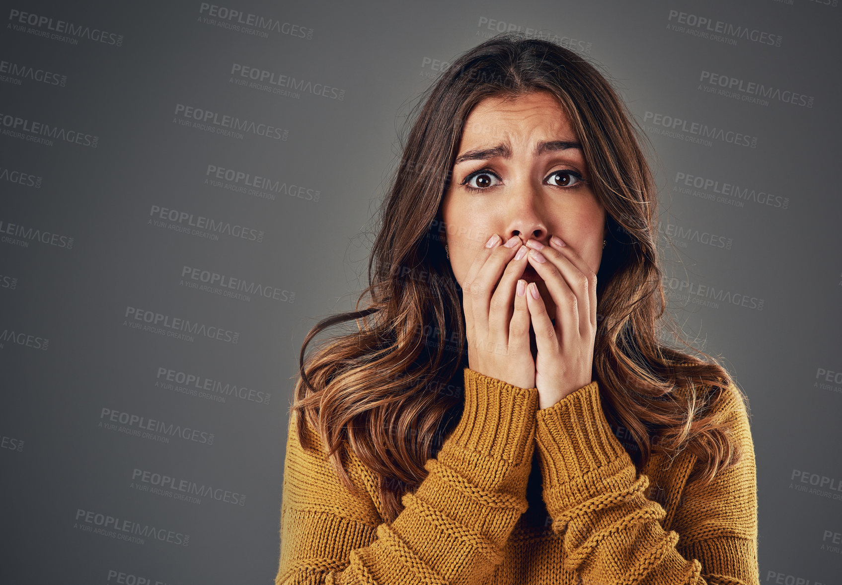 Buy stock photo Portrait, scared and woman with fear, afraid and anxiety with secret news on grey studio background. Face, person and model with surprise, shocked and cover mouth with emotions and emoji of gossip