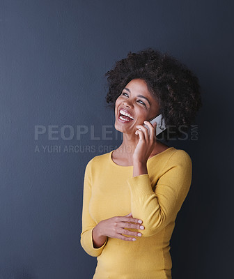 Buy stock photo Studio shot of an attractive young woman talking on her phone against a grey background