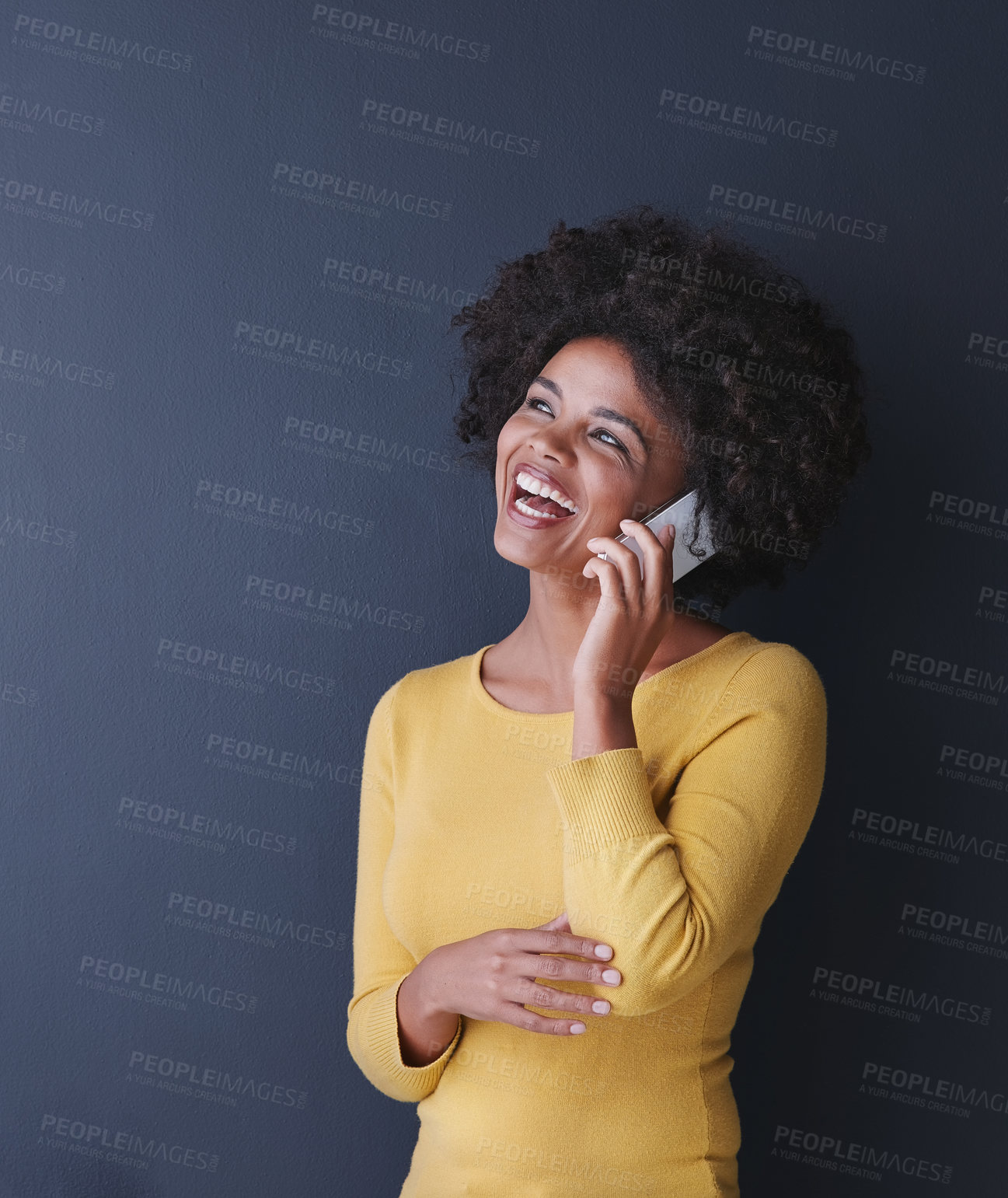Buy stock photo Studio shot of an attractive young woman talking on her phone against a grey background