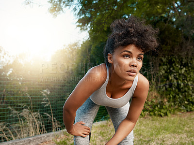 Buy stock photo Black woman, tired and outdoor with breathing for fitness, exercise and wellness as sports goal. Girl, vision and break by grass with rest or commitment for health, workout or marathon training 
