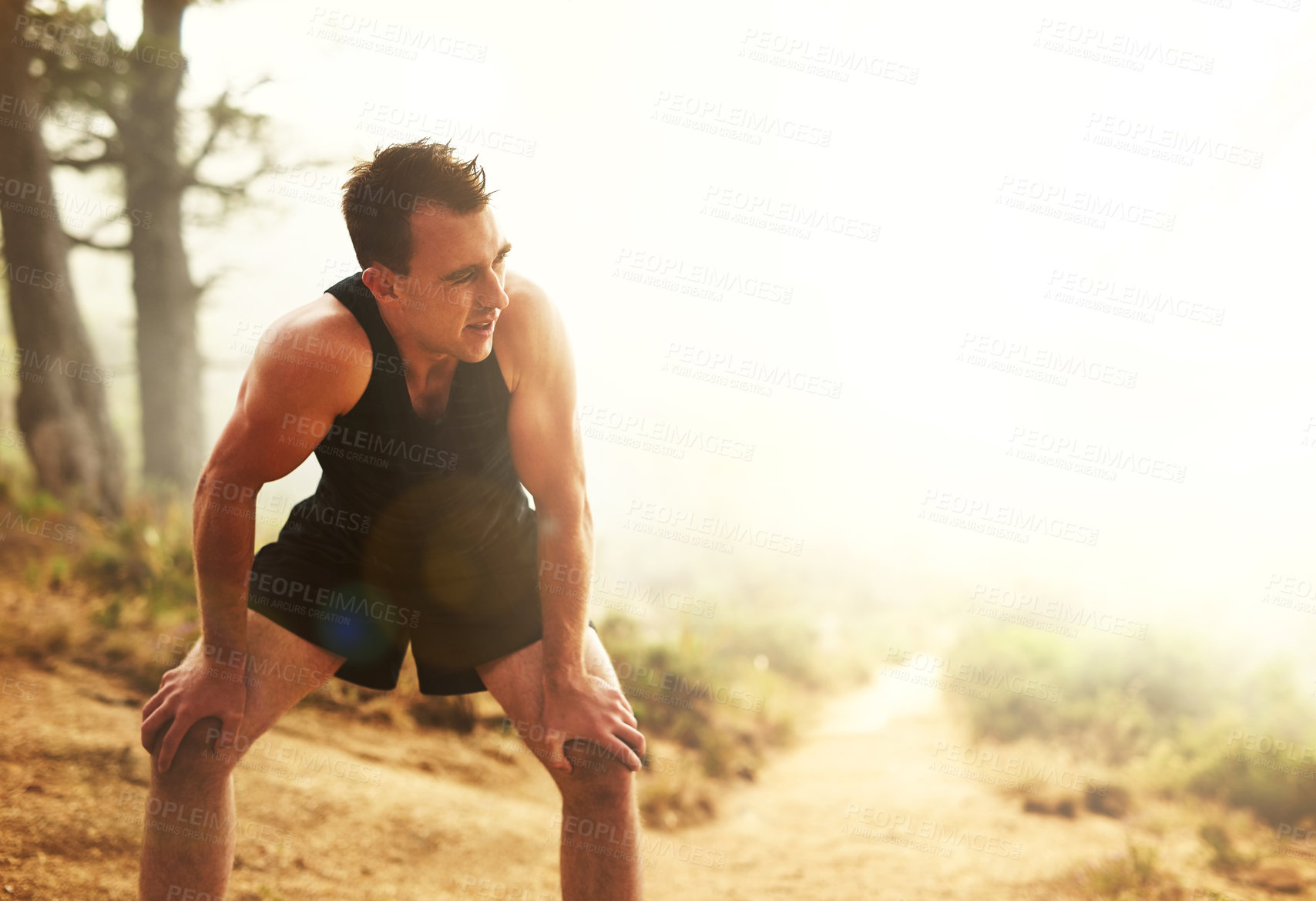 Buy stock photo Man, nature and running with break for breathing or performance, exercise in countryside for wellness. Male runner, workout and stop for recovery with misty air, outdoor with tired body in Canada