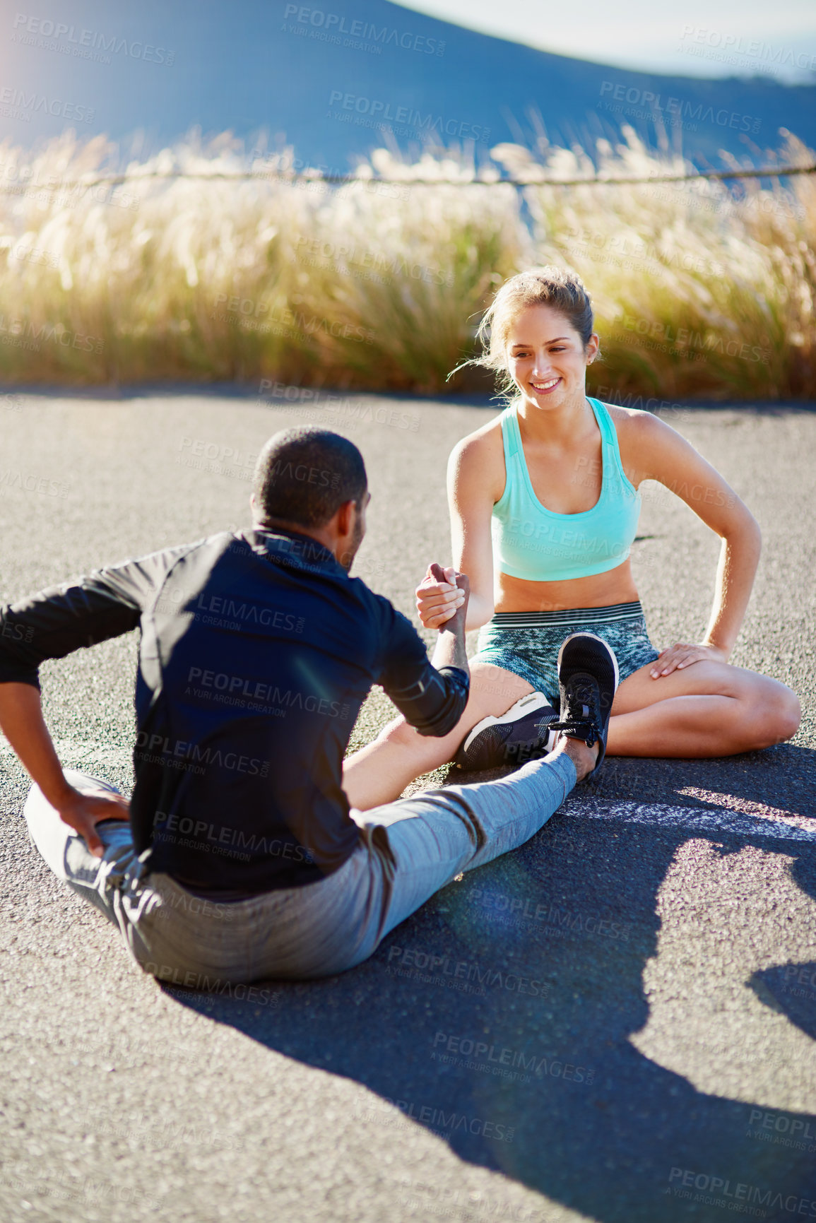 Buy stock photo Nature, exercise and couple with stretching on floor for sports, training and support in warm up. Happy, woman and man with hands together in flexibility for muscle strength, fitness and healthy body