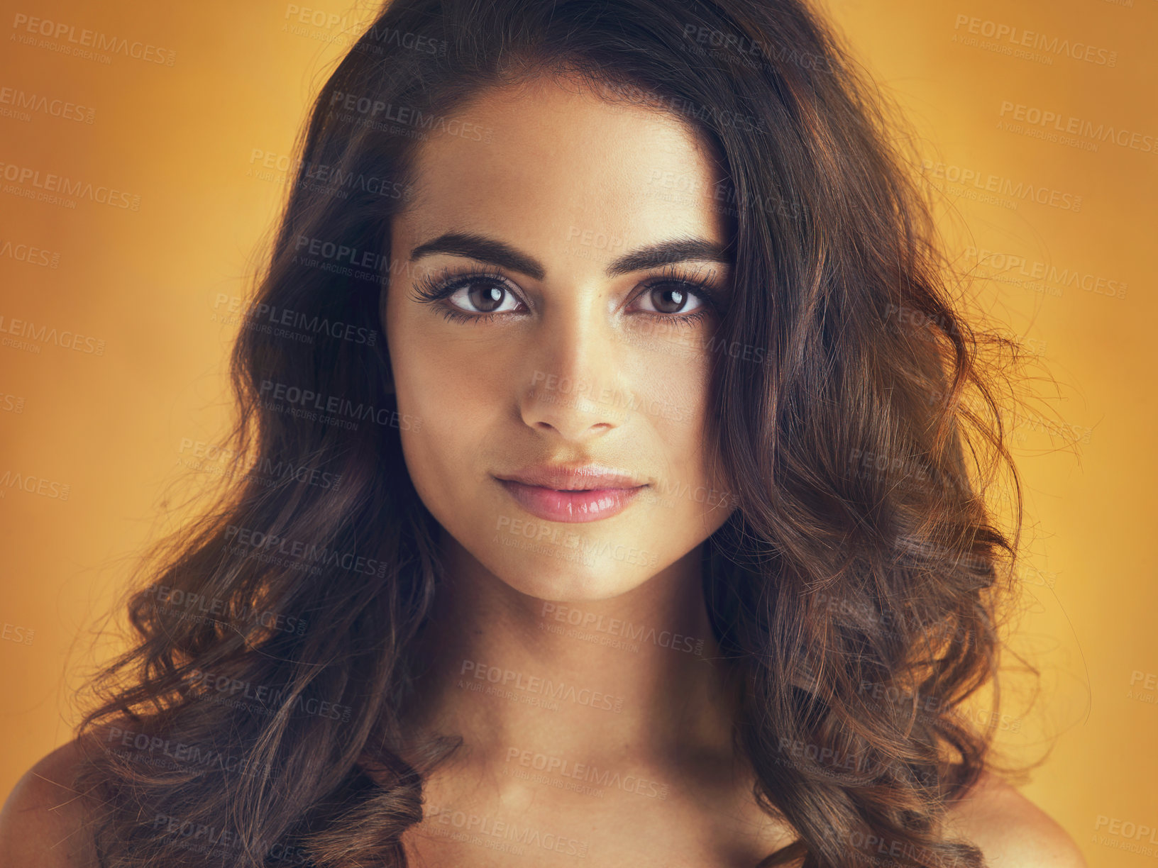 Buy stock photo Cropped shot of a beautiful young woman posing in the studio