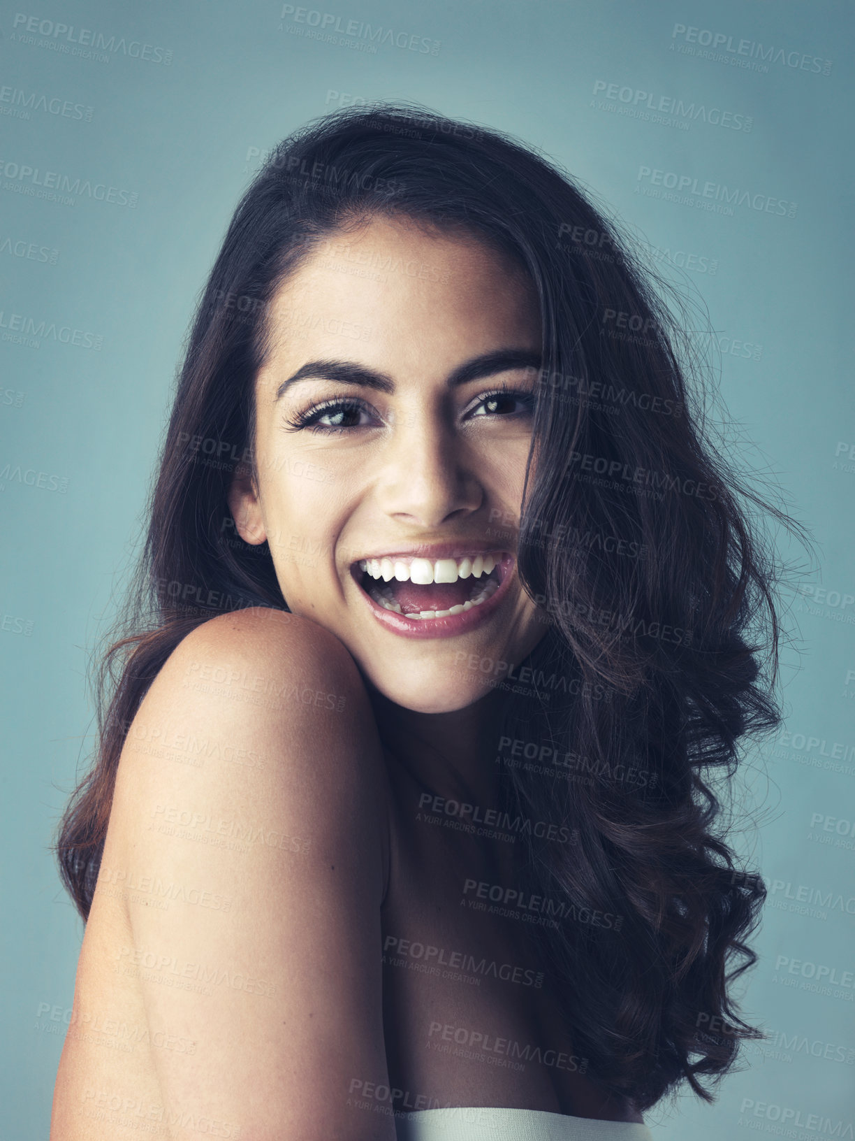 Buy stock photo Laugh, portrait or woman in studio for hair care, smooth or growth with collagen treatment with results. Female model, beauty or cosmetics for soft texture, healthy volume or shine by blue background