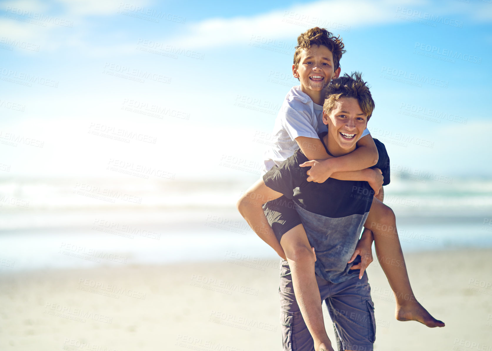 Buy stock photo Piggyback, portrait or boys at beach with smile or love for fun summer vacation, holiday or playing. Siblings, mockup space or happy kids outdoors in Spain at ocean for travel or family adventure