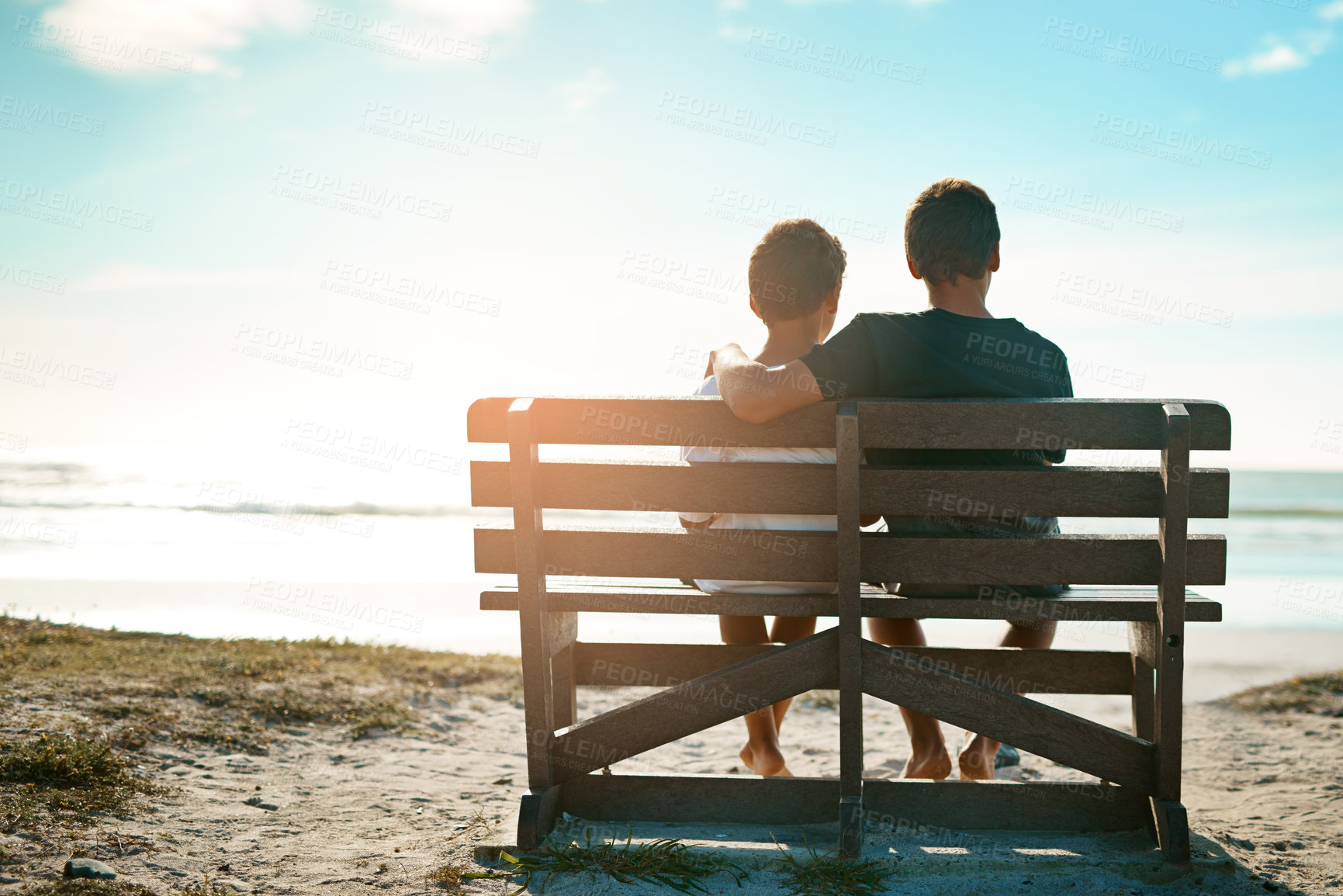 Buy stock photo Love, children and brothers hug on beach bench at sunset with care, trust and bonding on vacation together. Ocean, travel or back of kid siblings at sea embrace on adventure, journey or Istanbul trip