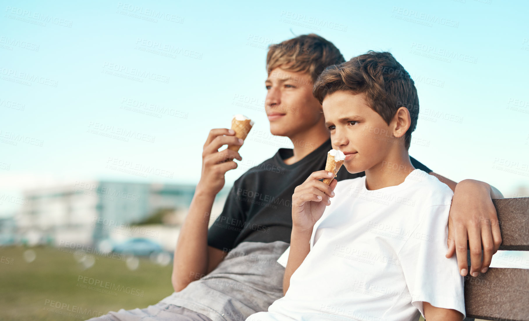 Buy stock photo Children, siblings and ice cream on a beach bench with love, care and bonding on vacation together. Family, summer or boy kids in nature with sweet dessert for cooling, relax and chilling in Istanbul