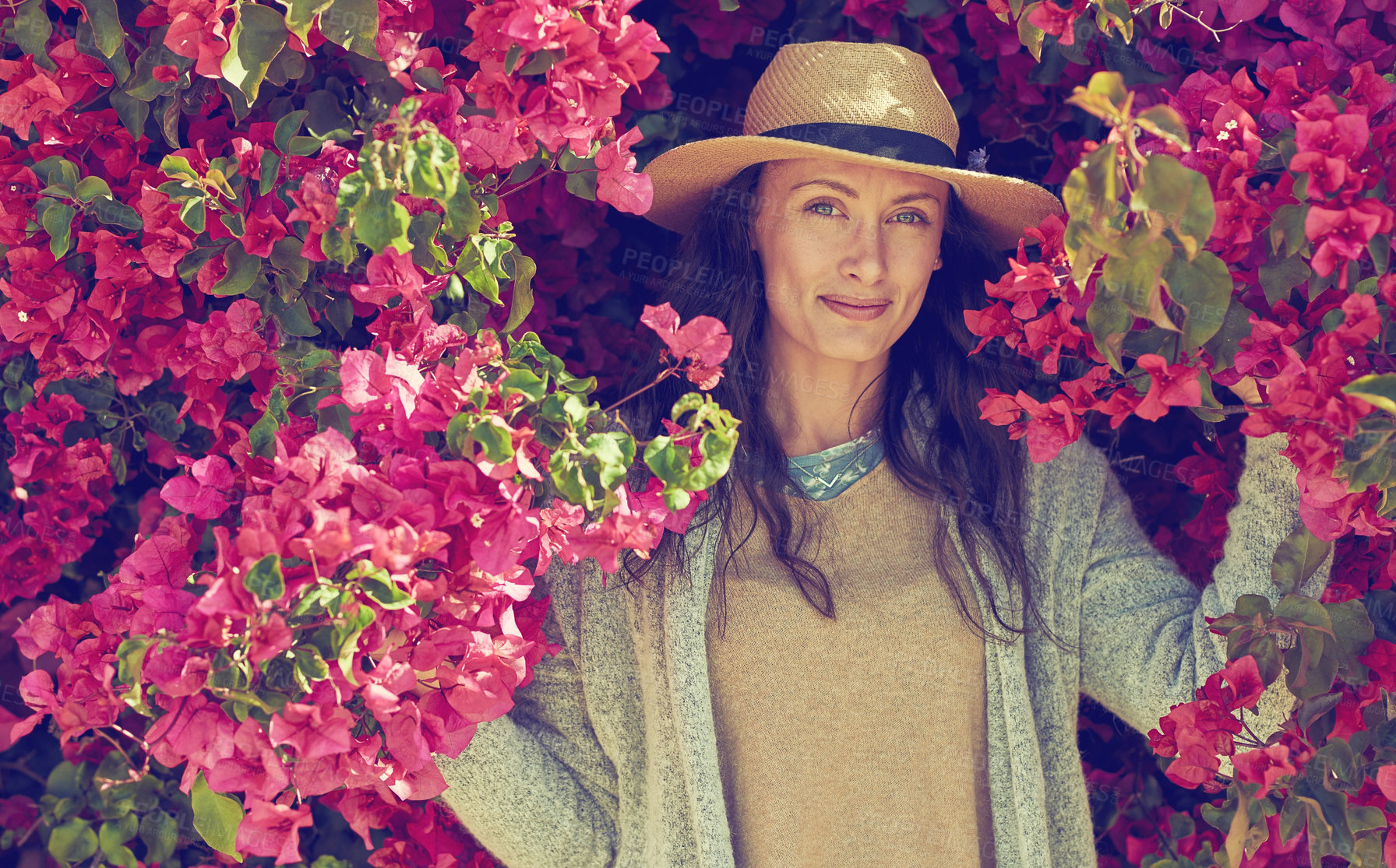Buy stock photo Woman, portrait and flowers with fashion outdoor for floral aesthetic, sustainable beauty and casual clothes. Female person, cool outfit and pink plants for summer season, bohemian stylish and bloom
