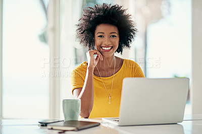 Buy stock photo Cropped portrait of an attractive young woman working on her laptop at home