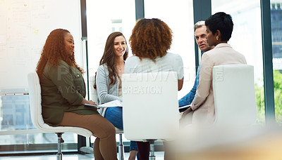 Buy stock photo Shot of a team of colleagues having a meeting in a modern office
