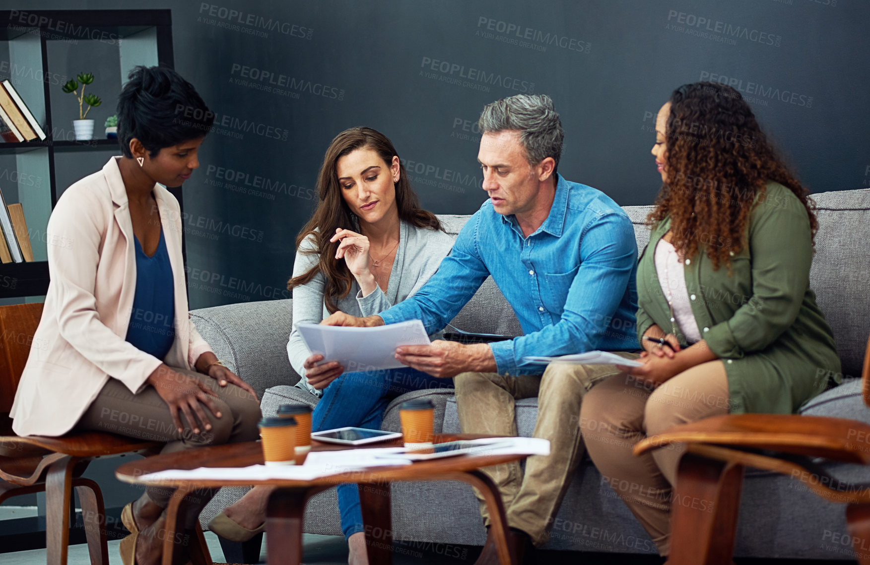 Buy stock photo Shot of a creative team meeting in the office