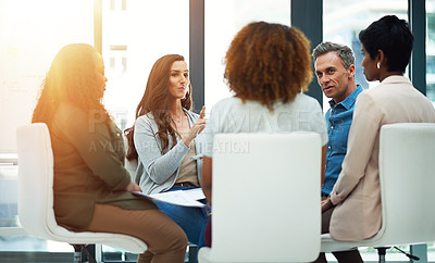 Buy stock photo Shot of a team of colleagues having a meeting in a modern office