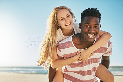 Buy stock photo Face, piggy back and beach with couple, love and sunshine with happiness, interracial and adventure. Portrait, seaside and man carrying woman with vacation, romance and summer with honeymoon or break