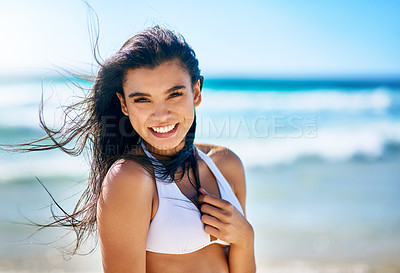 Buy stock photo Portrait of a beautiful young woman in a white bikini posing on the beach