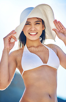 Buy stock photo Portrait of a beautiful young woman in a white bikini posing on the beach
