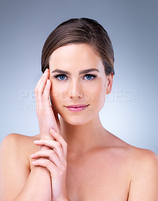 Buy stock photo Confident, woman and portrait for skincare in studio on grey background with smooth face, glow or natural shine. Beauty, proud model and elegant person with cosmetics, wellness or dermatology results