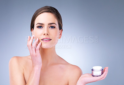 Buy stock photo Skincare, portrait or woman with face cream application in studio for wellness, repair or shine on grey background. Beauty, facial and girl model with skin product, treatment or dermatology sunscreen