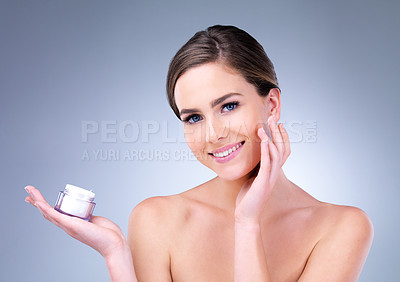 Buy stock photo Skincare, hands and portrait of happy woman with face cream application in studio for dermatology, wellness and glow on grey background. Beauty, product or girl model with sunscreen, lotion or facial