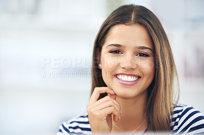 Buy stock photo Portrait of an attractive young woman relaxing at home