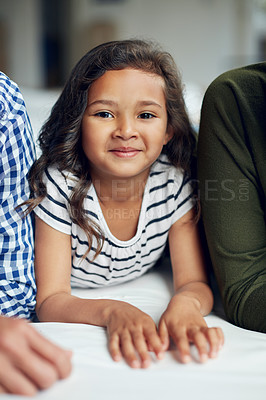 Buy stock photo Portrait of an adorable little girl bonding with her family at home
