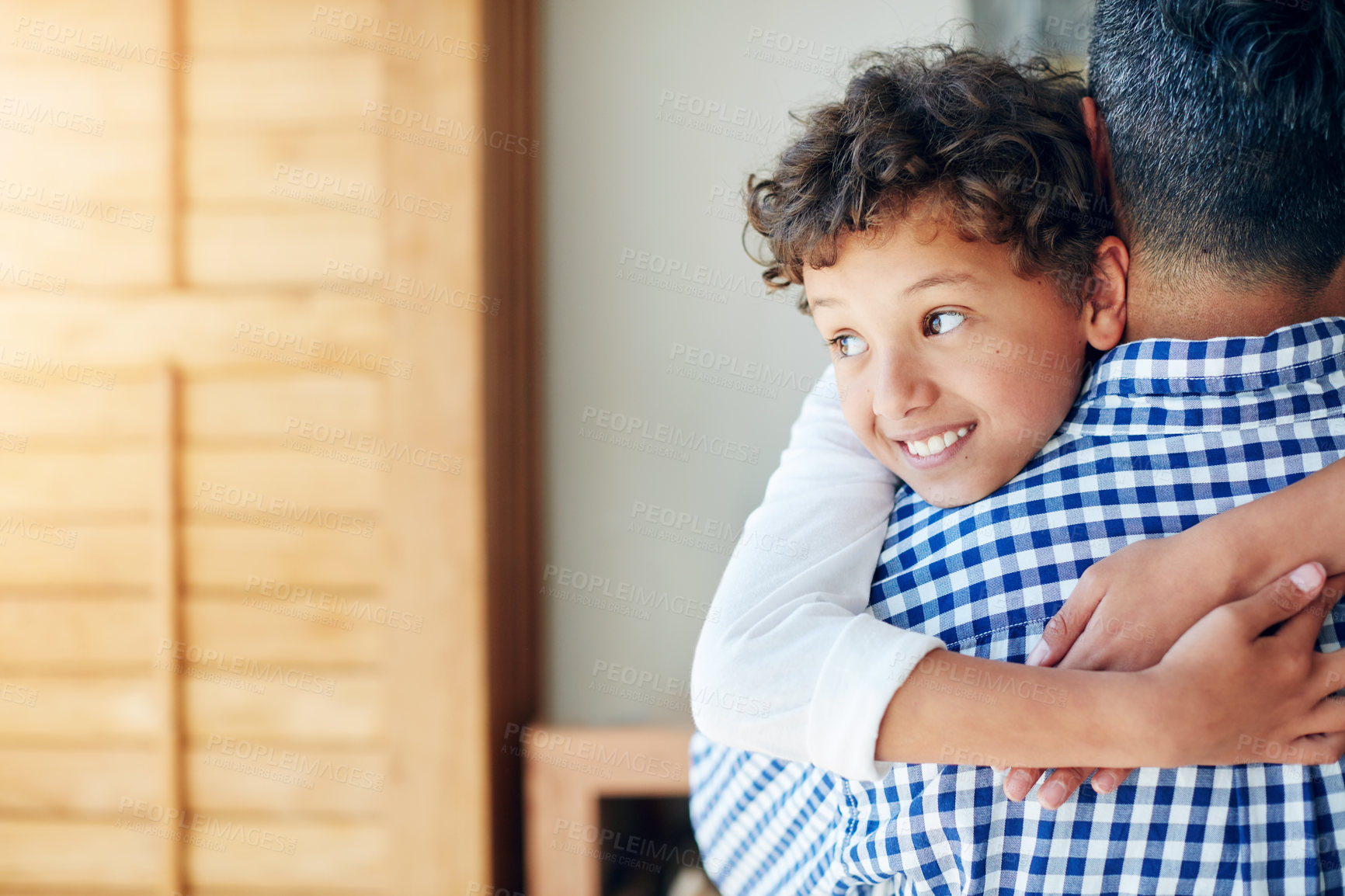 Buy stock photo Happy, boy and father hugging in house with love, bonding and together for relationship with caring embrace. Relaxing, family and apartment for childcare or parent, affection and kid smiling in house