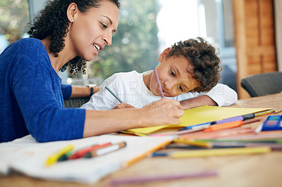 Buy stock photo Creativity, mother and son drawing on paper together for learning, playing and development in home. Happy, woman and boy child with notes for support, education and teaching in house or artistic