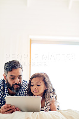 Buy stock photo Love, digital tablet and father with daughter on a bed for reading, story and learning in their home together. Family, streaming and parent and girl relax in bedroom online with ebook or subscription