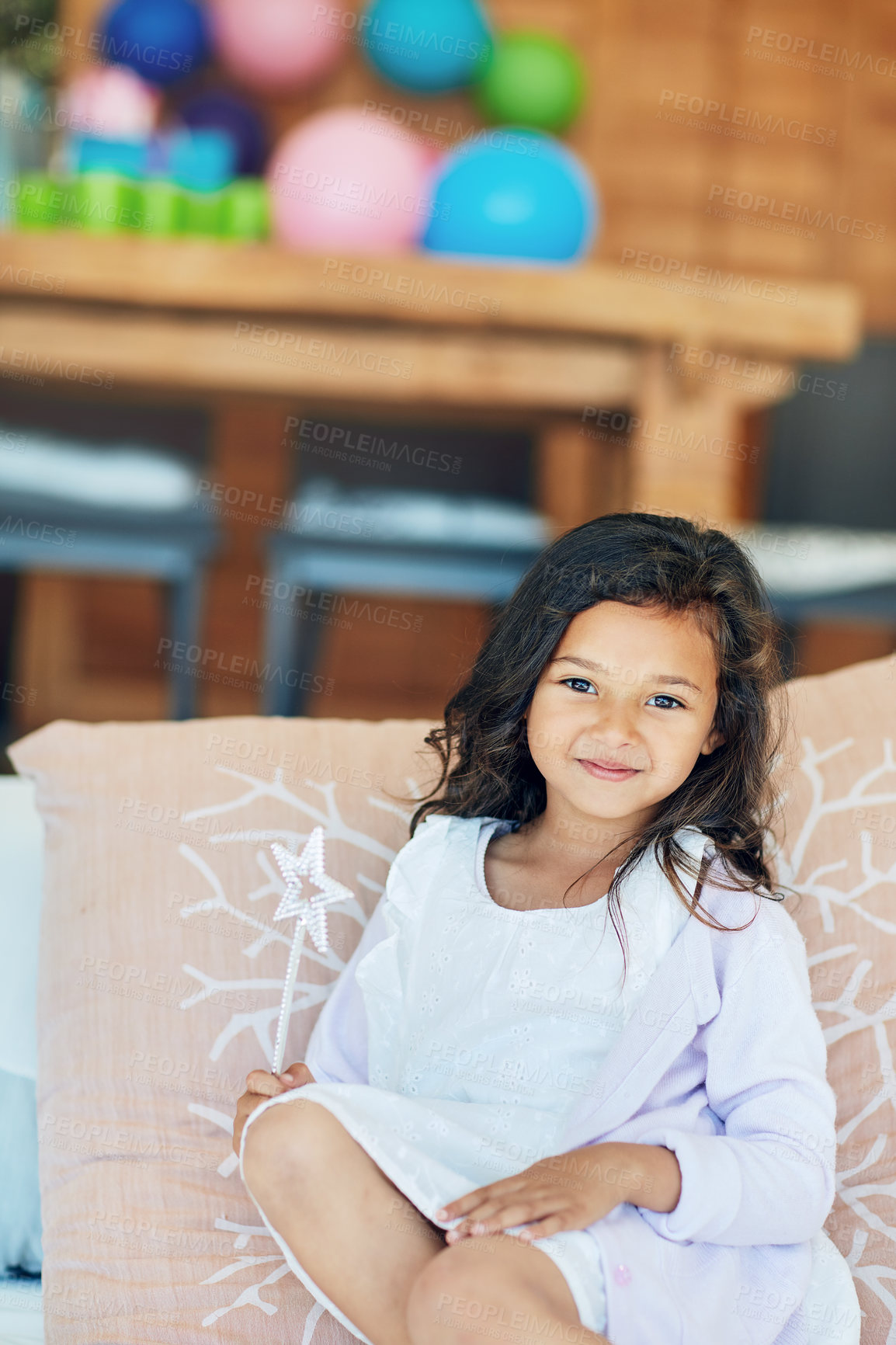 Buy stock photo Portrait of a cute little girl playing with a fairy wand at home