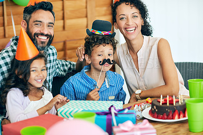 Buy stock photo Portrait of a happy little boy celebrating his birthday with his family at home