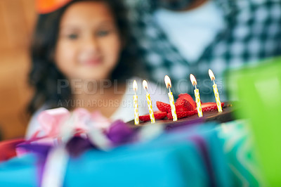 Buy stock photo Portrait of a cute little girl celebrating her birthday with her parents at home