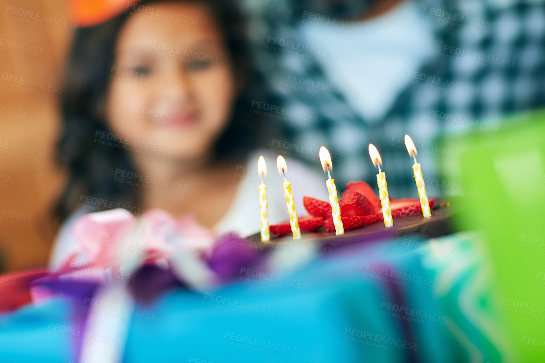 Buy stock photo Portrait of a cute little girl celebrating her birthday with her parents at home