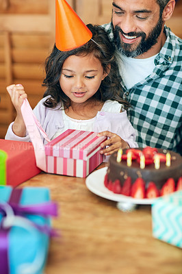 Buy stock photo Portrait of a cute little girl celebrating her birthday with her parents at home