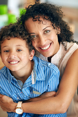 Buy stock photo Portrait of a happy mother posing with her adorable little boy at home