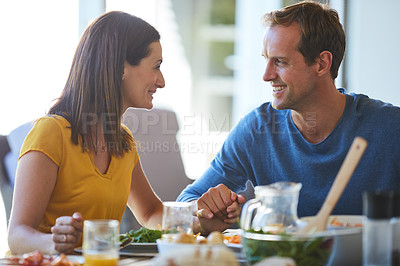 Buy stock photo Cropped shot of a mature couple enjoying a meal together at home