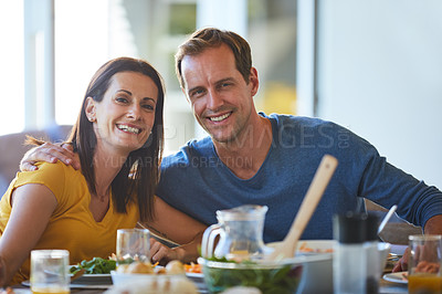 Buy stock photo Portrait of a mature couple enjoying a meal together at home