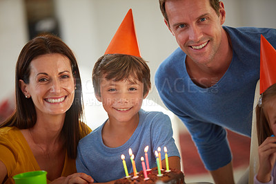 Buy stock photo Portrait of a happy family having a birthday party at home
