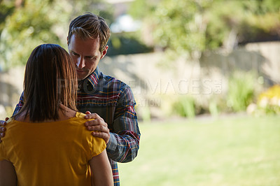 Buy stock photo Cropped shot of a man comforting his wife